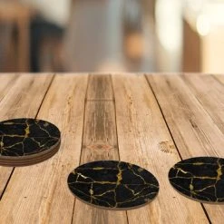 KitchenYeah Onderzetters Voor Glazen - Onderzetters - Zwart - Goud - Marmer Look - 10x10 Cm - Rond - 6 Stuks -Tefal Shop 550x366 36